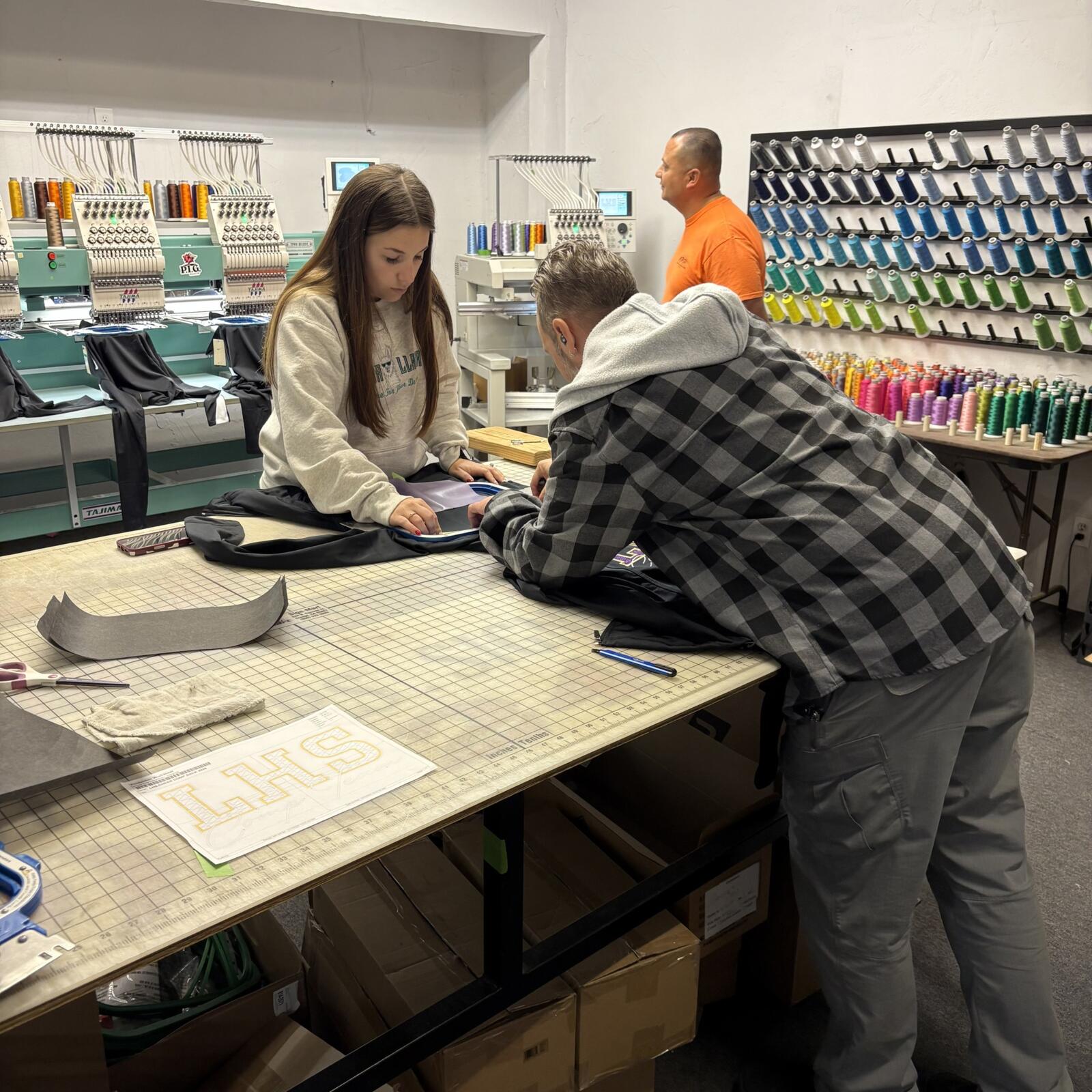 Working in the embroidery room at Plain Insane Graphix  Lemoore